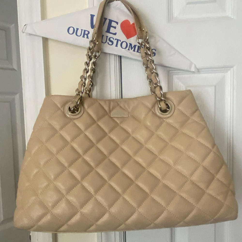 Kate Spade Tan color quilted hand bag with wear and tear